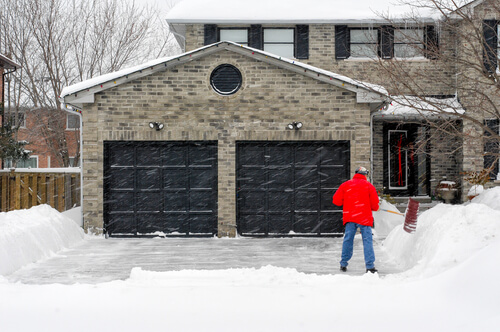 Black Garage Door in Snow